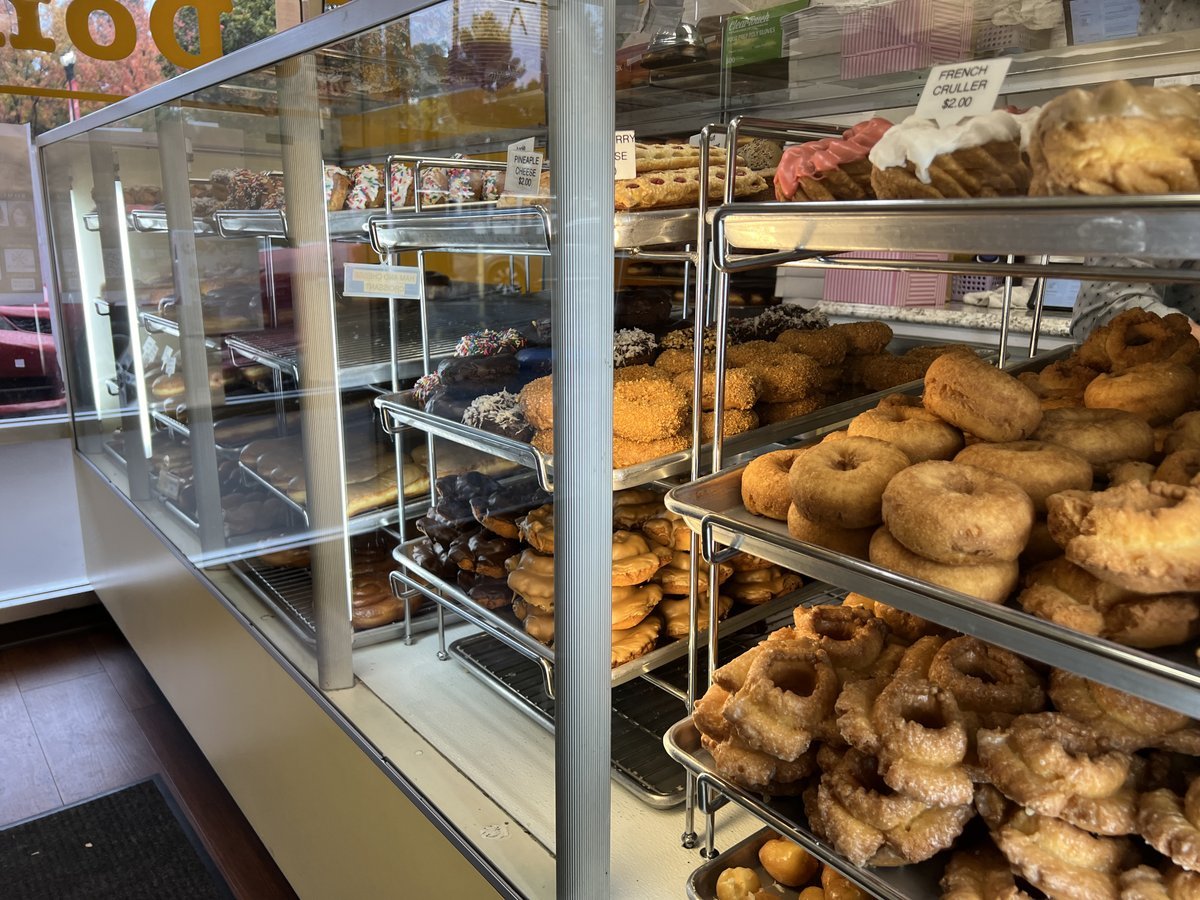 Donuts on display in a case at Johnnys Donuts in Lafayette